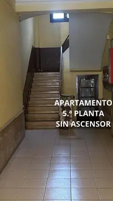 an empty hallway with stairs in a building at Encantador piso en Benimaclet in Valencia