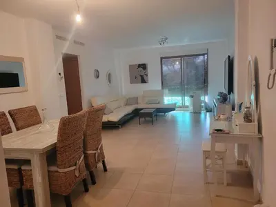 a living room with a couch and a table at APARTAMENTO MODERNO y ACOGEDOR in Canet de Berenguer