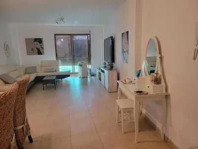 a living room with a couch and a table at APARTAMENTO MODERNO y ACOGEDOR in Canet de Berenguer
