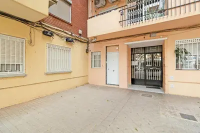 an empty parking lot in front of a building at GuestReady - Apartamento en Benicalap in Valencia