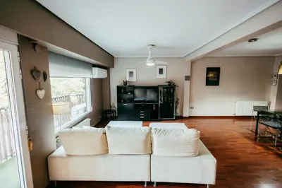 a living room with a white couch and a table at Apt Ruzafa, City Centre 10 Min, Terrace, 2 Rooms in Valencia