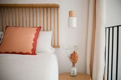 a bedroom with a bed and a vase on a table at Lofts plaza JM Orense B in Valencia