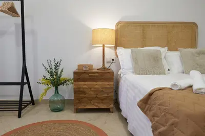 a bedroom with a bed and a lamp on a night stand at Loft 9 in Valencia