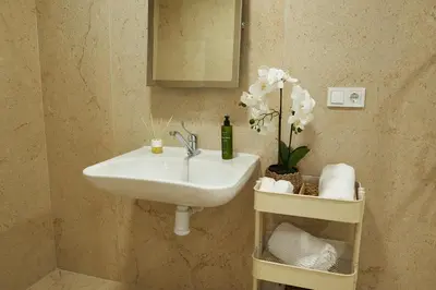 a bathroom with a sink and a mirror at Loft 9 in Valencia