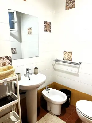 a bathroom with a sink and a toilet at Guillem Silence in Valencia