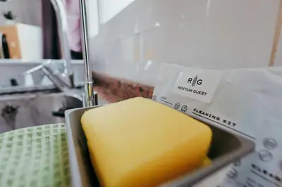 a block of cheese in a sink in a kitchen at Apt Cabanyal, Beach 8 Min, Terrace, Smart TV in Valencia