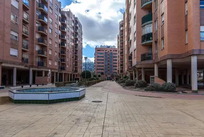 an empty street in a city with tall buildings at Valencia Flat Rental Swim and Paddle in Valencia