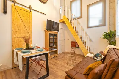 a living room with a couch and a table at Apartamento Beniloft - Housevanlive in Valencia
