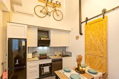 a kitchen with a bike hanging on the wall at Apartamento Beniloft - Housevanlive in Valencia