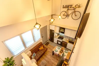 an overhead view of a living room with a bike on the wall at Apartamento Beniloft - Housevanlive in Valencia