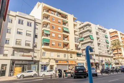 a tall building on a city street with cars parked at GuestReady - Elegant Retreat in Valencia in Valencia