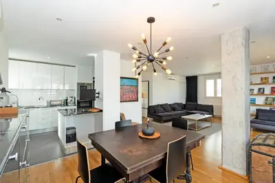 a dining room and living room with a table and chairs at GuestReady - Elegant Retreat in Valencia in Valencia