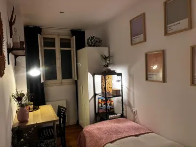 a small room with a table and a refrigerator at GuestReady - Elegant Retreat in Valencia in Valencia
