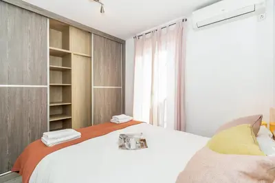 a bedroom with a white bed and a window at GuestReady - Elegant Retreat in Valencia in Valencia