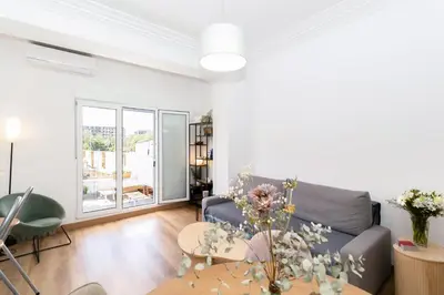 a living room with a couch and a table at GuestReady - Valencia's Sushine Terrace in Valencia