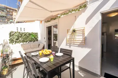 a table with bananas on top of a balcony at GuestReady - Valencia's Sushine Terrace in Valencia