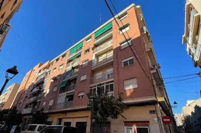 a tall brick building on a city street at GuestReady - A joyful stay in Poblats Marítims in Valencia