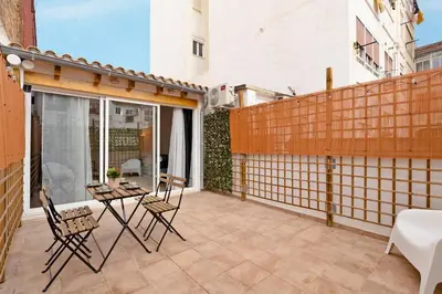 a patio with chairs and a table on a balcony at GuestReady - Superb retreat in Ruzafa in Valencia