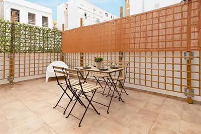 a patio with a table and chairs on a balcony at GuestReady - Superb retreat in Ruzafa in Valencia