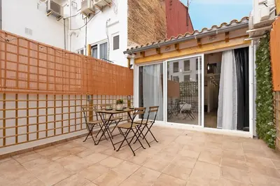 a patio with a table and chairs on a balcony at GuestReady - Superb retreat in Ruzafa in Valencia