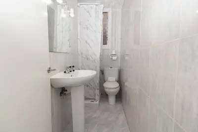 a white bathroom with a sink and a toilet at GuestReady - A lovely gem near La Malvarrosa beach in Valencia