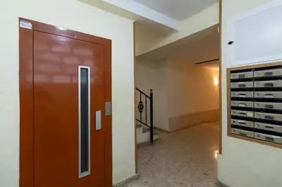 a room with a door and a bunch of wine racks at GuestReady - A lovely gem near La Malvarrosa beach in Valencia