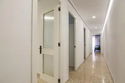 a corridor with an open door in a hallway at GuestReady - Tranquil Haven in Canyamelar in Valencia