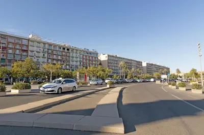 a city street with cars parked on the road at GuestReady - Piso moderno con vistas a la Marina in Valencia