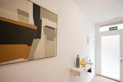 a large painting on a wall in a room at FLORIT FLATS - The Maritim Metro Station Suites in Valencia