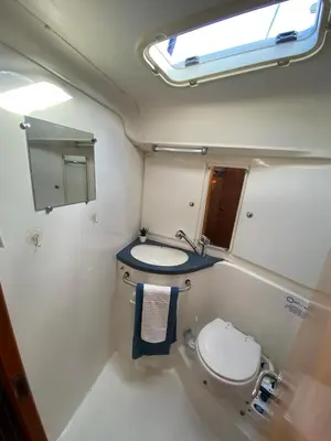 a small bathroom with a toilet and a sink at Velero en puerto de valencia in Pinedo