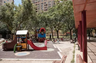 a playground in a park with children playing on it at Lofts plaza JM Orense C in Valencia