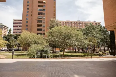 a park with trees and buildings in a city at Lofts plaza JM Orense C in Valencia