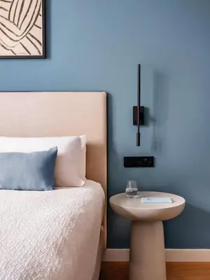 a bedroom with a bed and a nightstand next to a bed at Numa Valencia La Xerea in Valencia