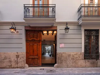 an entrance to a building with a wooden door at Numa Valencia La Xerea in Valencia