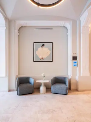 a waiting room with two chairs and a table at Numa Valencia La Xerea in Valencia