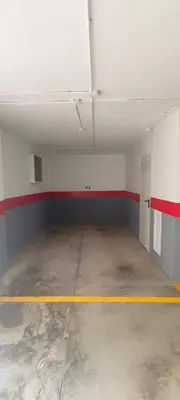 an empty room with a yellow line in a garage at Apto en Cullera con terraza, piscina, parking y wifi gratis in Cullera