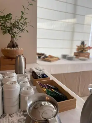 a counter with a bunch of cups and a box at Hotel Santamarta in Cullera