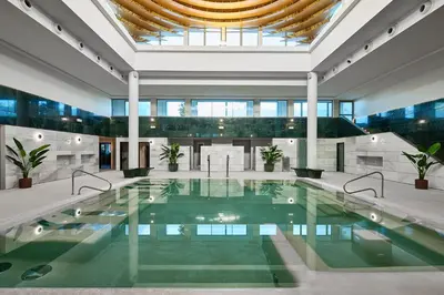 a large swimming pool in a building with a ceiling at Calderona Wellness in Bétera