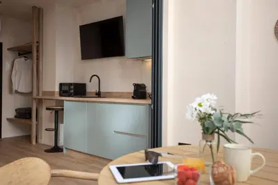 a small kitchen with a table and a table sidx sidx sidx at Nomad Haux Mestalla in Valencia