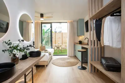a bathroom with a large mirror and a sink at Nomad Haux Mestalla in Valencia