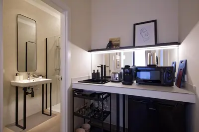 a bathroom with a counter with a microwave and a sink at Osito Hub - Llorens in Valencia