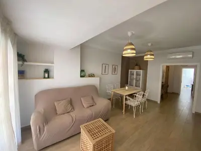 a living room with a couch and a table at Sun & Sea Cullera in Cullera