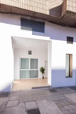 a white house with a potted plant in a courtyard at Imprenta Sorolla by Concept in Valencia