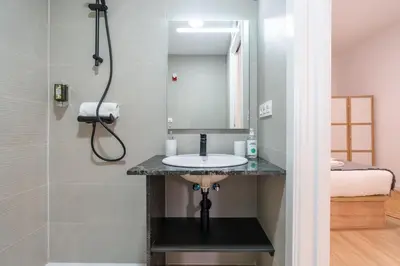a bathroom with a sink and a shower at VLC HOST - Ausias March in Valencia