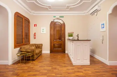 a living room with a couch and a door at Hi Valencia Boutique in Valencia