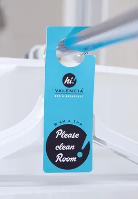 a blue tag sitting on top of a refrigerator at Hi Valencia Boutique in Valencia