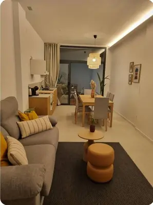 a living room with a couch and a table at Loft Taronja Ruzafa-Parque central in Valencia