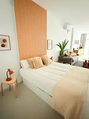 a bedroom with a large white bed in a room at Loft Taronja Ruzafa-Parque central in Valencia