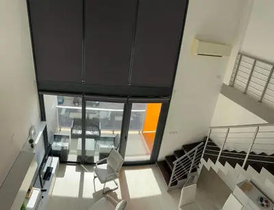 an overhead view of a room with a staircase and a chair at Mi Huésped Valencia, Aeropuerto Manises in Manises