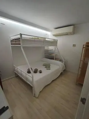 a bedroom with two bunk beds in a room at Mi Huésped Valencia, Aeropuerto Manises in Manises